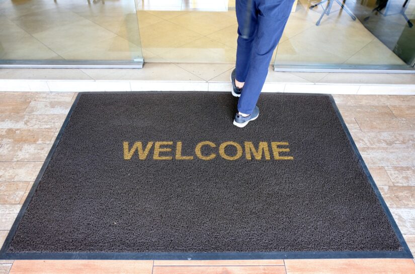 Person Walking Image Of A Person Entering Building